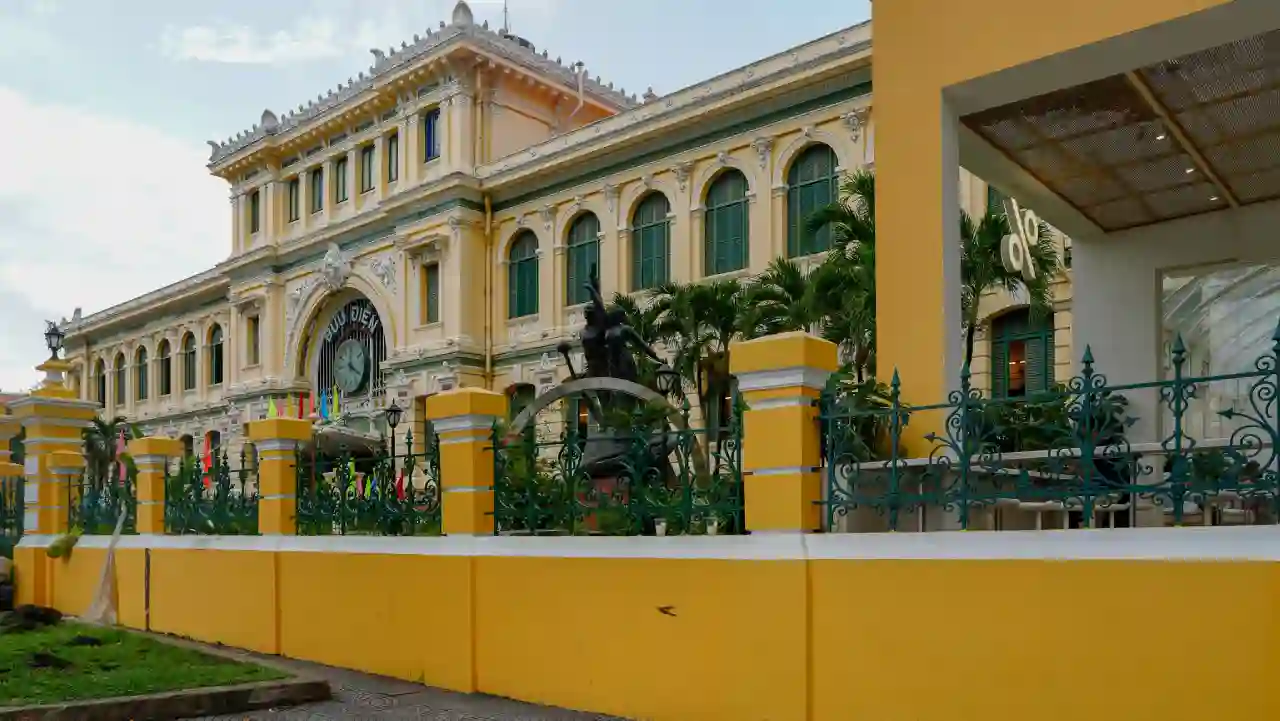 Saigon Central Post Office yellow colonial facade with iron gates