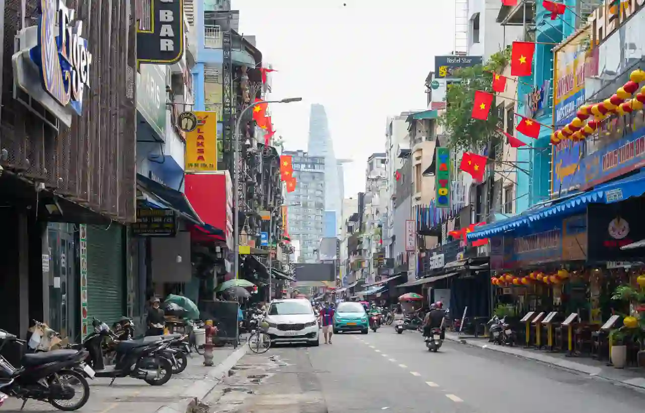 Downtown Saigon side street with Bitexco Tower in the distance